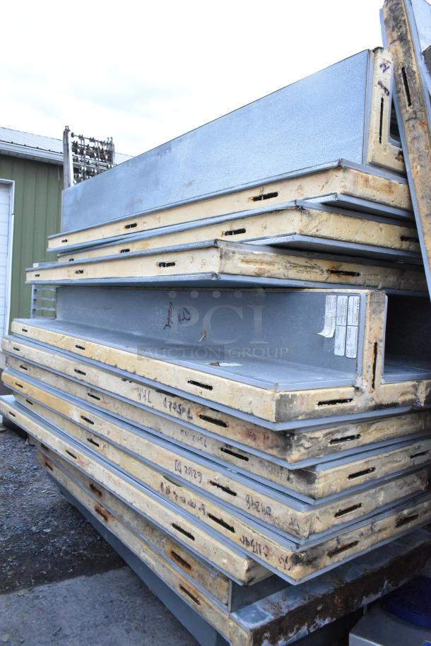 Norlake walk-in panels stacked, for combo 18'x6'x8' cooler-freezer. Panels show wear and markings. Includes tags.