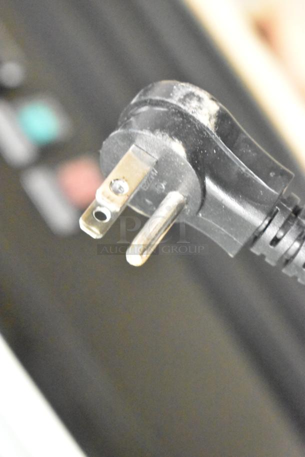 Close-up of the plug for the Avantco 178GDC12FHCB freezer, highlighting a portion of its electrical cord.