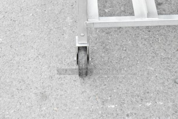 Channel CSR-9M metal commercial pan rack with sturdy commercial casters, ideal for restaurant use. Slightly worn condition.