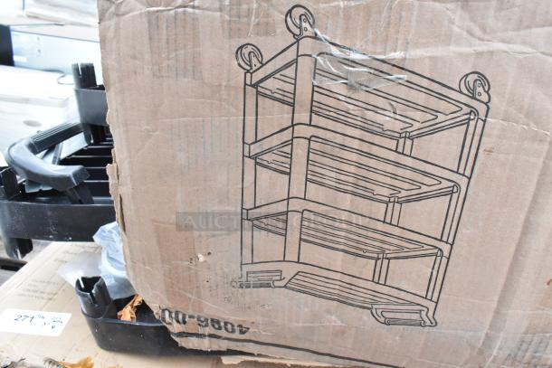 Cardboard box labeled with rack illustration, displaying new scratch and dent items; includes reinforcement table and bar alloy.