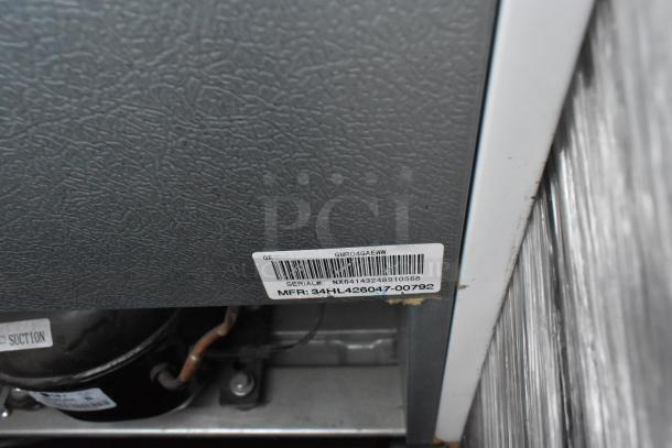 5 mini coolers including Galanz GLR25MBKE02, GLR33MBKE23, 120V, 1 phase. Label shows GE model GMR04GAEWW, serial NX6414324810568.