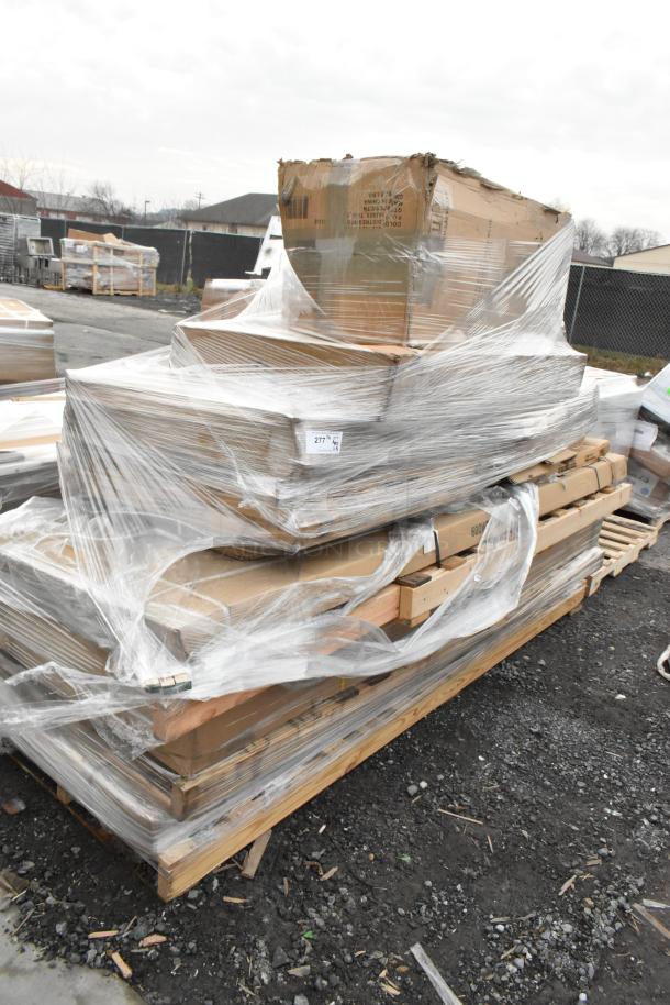 Scratch and dent lot of 14 new items including work tables and a wire shelf, wrapped on a pallet.