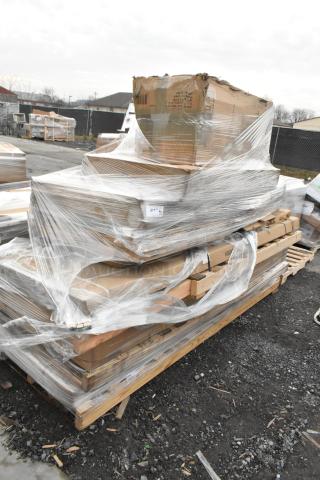 Scratch and dent lot of 14 new items including work tables and a wire shelf, wrapped on a pallet.