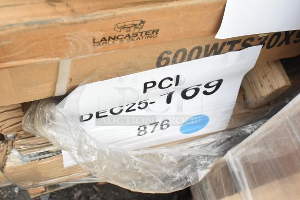 Cardboard boxes of Lancaster Table & Seating, labeled PCI DEC25-169, showing scratch and dent condition.