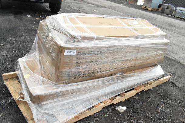 Shrink-wrapped pallet containing Regency items, including wall shelf and work table, labeled as scratch and dent, new condition.