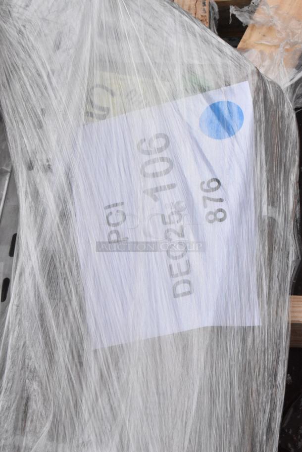 Plastic-wrapped pallet containing six brand new scratch and dent items, including a wall shelf and work table. Label reads "PCI DEC25-106 876".