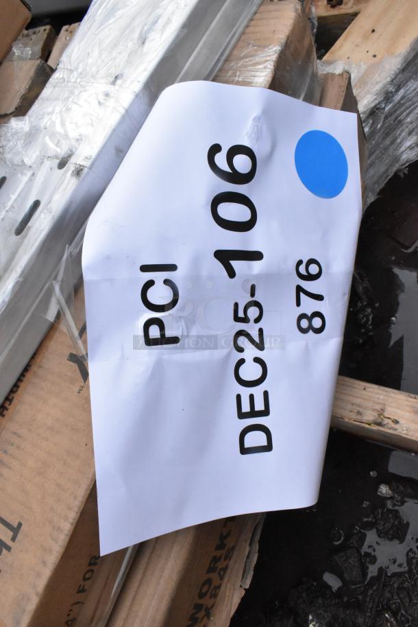 9 brand new scratch and dent items including shelving unit; tag reads "PCI DEC25-106 876."