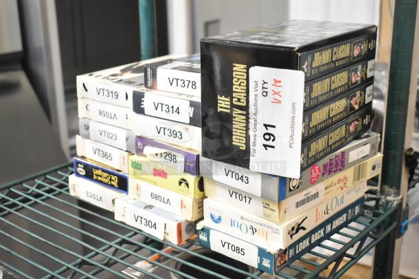 18 assorted VHS tapes including Jeffrey, Three Men and a Baby, and Johnny Carson Collection; good condition, labels with IDs.