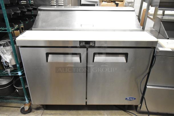 Atosa MSF8302 stainless steel sandwich salad prep table with mega top, commercial casters, and 115V plug.