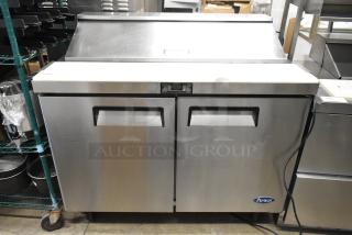 Atosa MSF8302 stainless steel sandwich salad prep table with mega top, commercial casters, and 115V plug.
