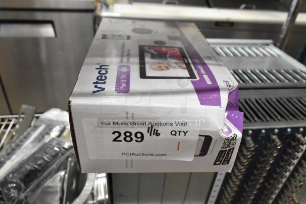 Vtech VM901HD Smart Wi-Fi Baby Monitor, new in original box, featuring pan and tilt camera. Auction label visible.