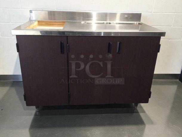 Custom stainless steel counter cabinet with dual sink and trash cutout, immaculate condition, commercial grade, fully inspected.