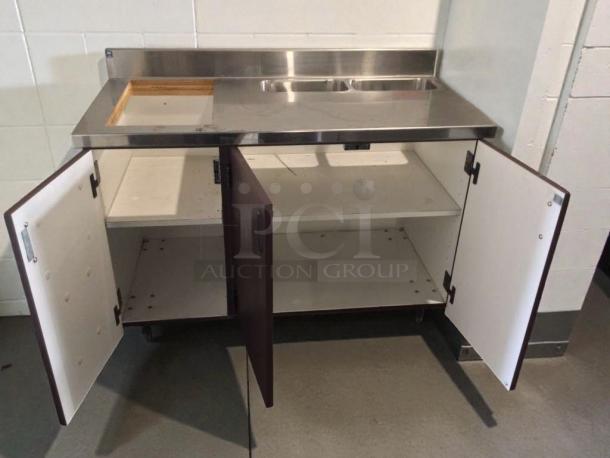 Custom stainless steel counter cabinet, dual sink, trash cutout, white interior. Immaculate condition, commercial grade, inspected.