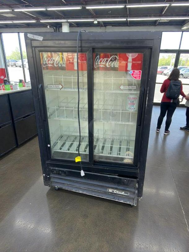True GDM-33SSL Coca-Cola glass door merchandiser refrigerator, excellent condition, tested, 115V, dual sliding doors.
