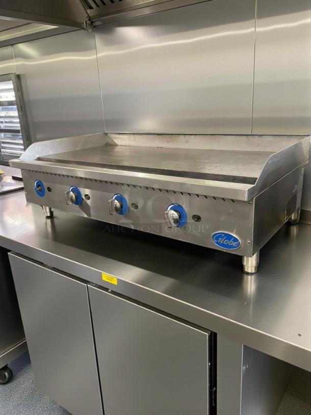 Pristine Globe Commercial Gas Griddle, stainless steel, fully tested, model GLO-L-GRD-0095, by Globe Food Equipment Co., USA.