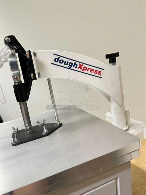DoughXpress Manual Dough Press, heavy-duty, countertop model. Features durable construction. "doughXpress" logo visible. Fully tested.
