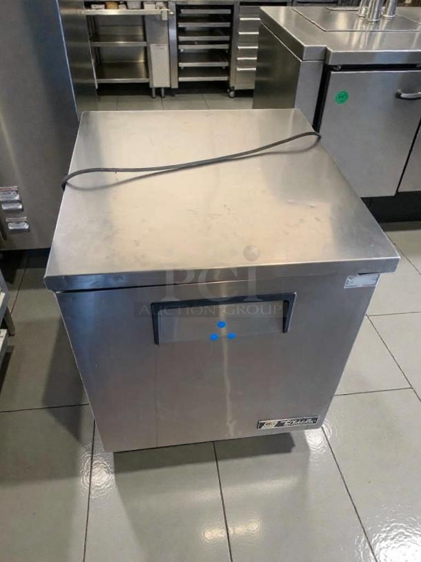 True TUC-27-LP undercounter refrigerator in immaculate condition, 115V, fully tested and working. Model tag visible.