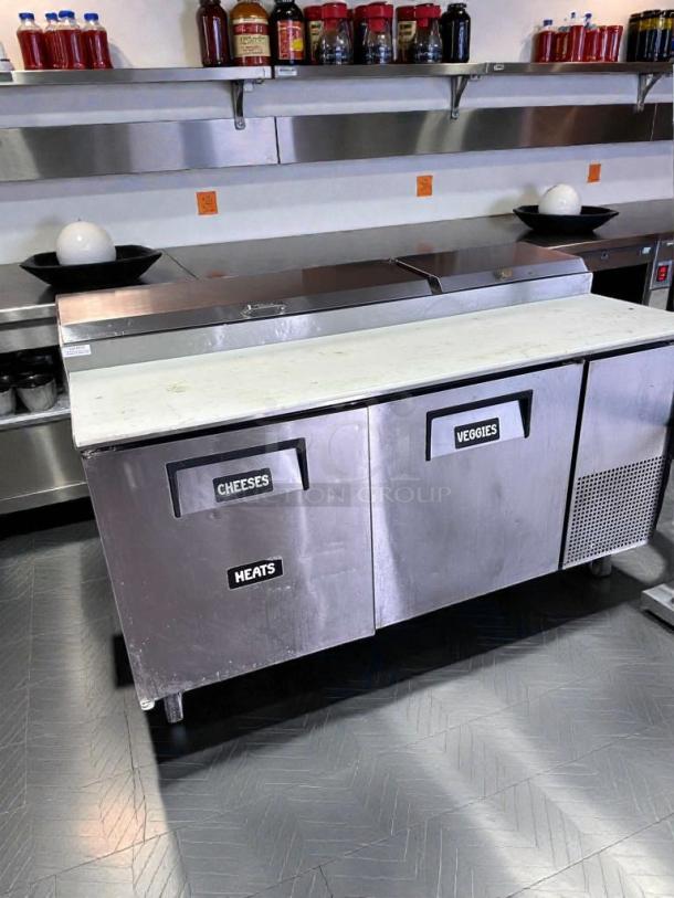 True TPP-67 commercial prep table, stainless steel, labeled doors for cheeses, veggies, heats. Tested, excellent condition.