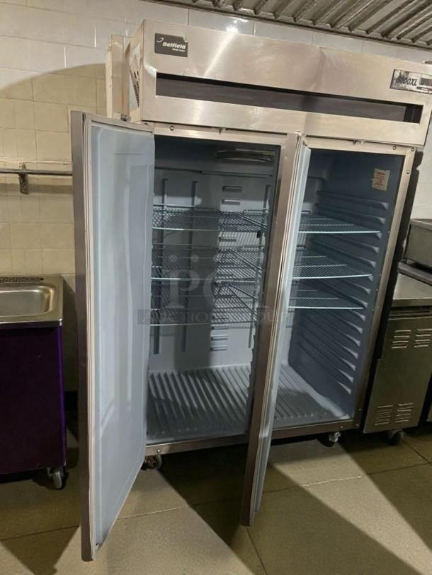 Delfield 6151XL-S15 commercial reach-in refrigerator, double doors open, stainless steel, 115V, fully tested and working.