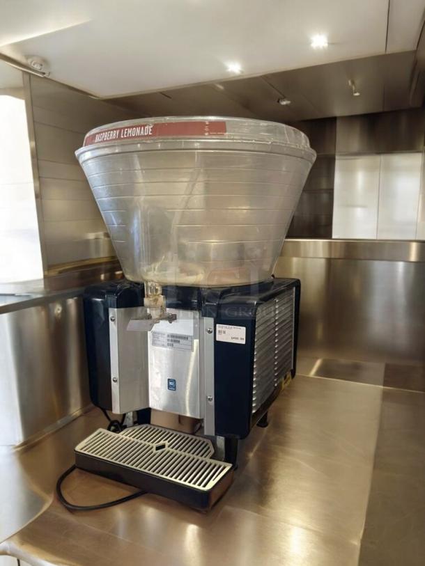 Pristine single-bowl lemonade dispenser, 115V, tested, with "Raspberry Lemonade" label, made by Commercial Beverage Equipment.