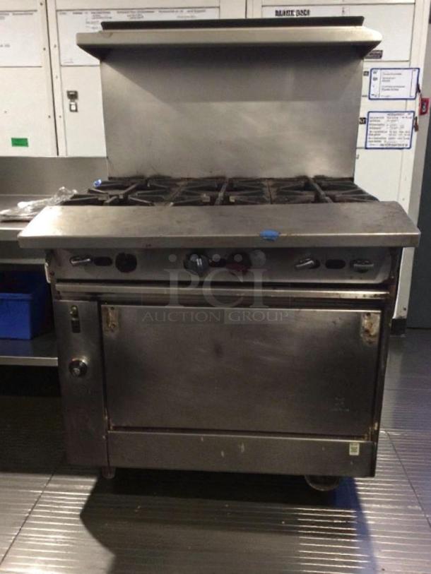 Commercial-grade 6-burner gas range with oven, stainless steel, premium condition, model GEN-L-RNG-0277, fully tested.
