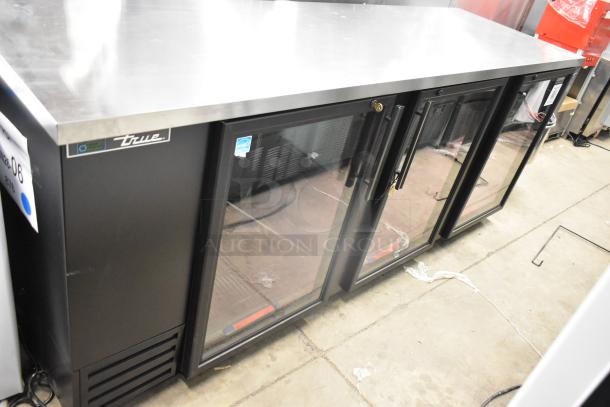Brand new 2025 True TBB-4G-HC-LD 3-door bar cooler, metal finish, 115V, 1 phase, visible scratch, True logo, labeled for merchandising.