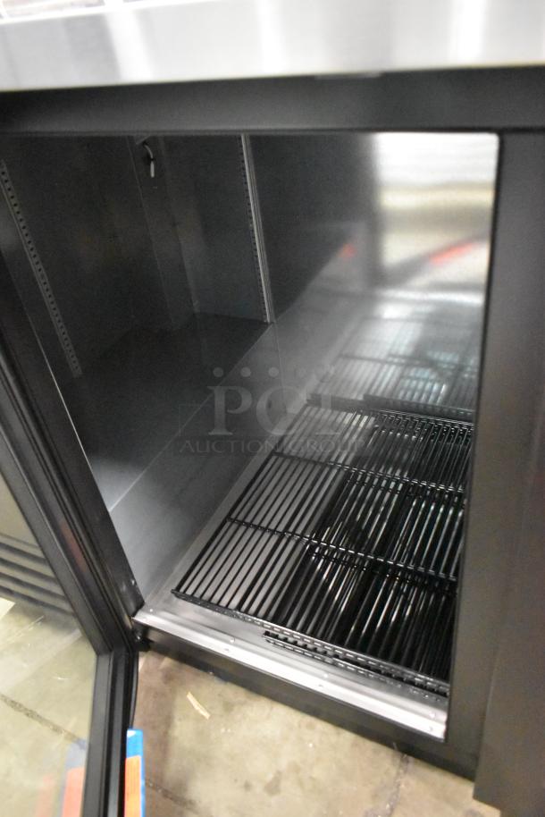 Brand new True TBB-4G-HC-LD back bar cooler, 3 glass doors, metal, 115V, 1 phase, minor scratches, spacious interior.