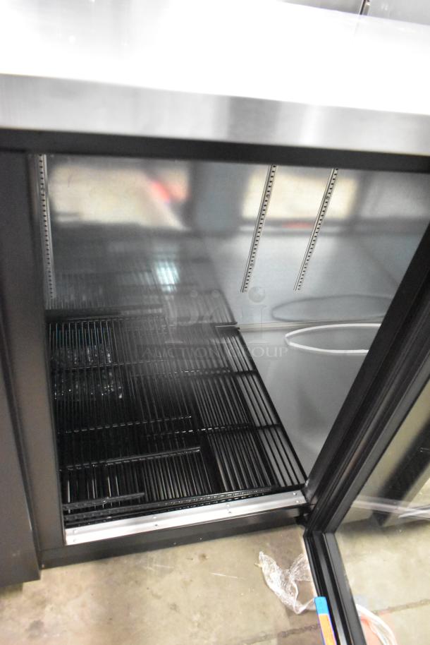 Brand new True TBB-4G-HC-LD commercial 3-door back bar cooler, metal finish, minor scratches, 115V, 1 Phase.