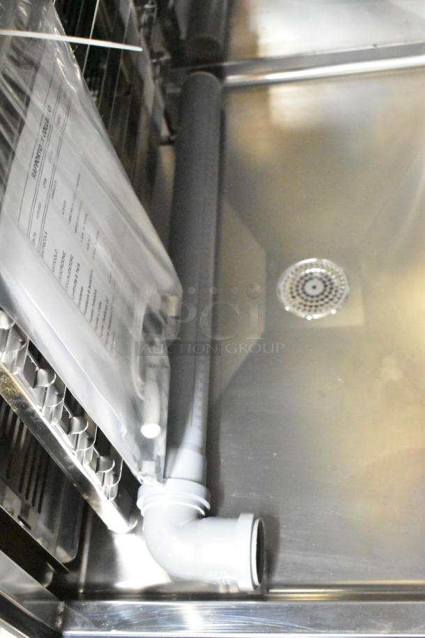 Stainless steel interior of Blodgett AETE101R combi oven. Features piping and document pouch. Scratch and dent condition.