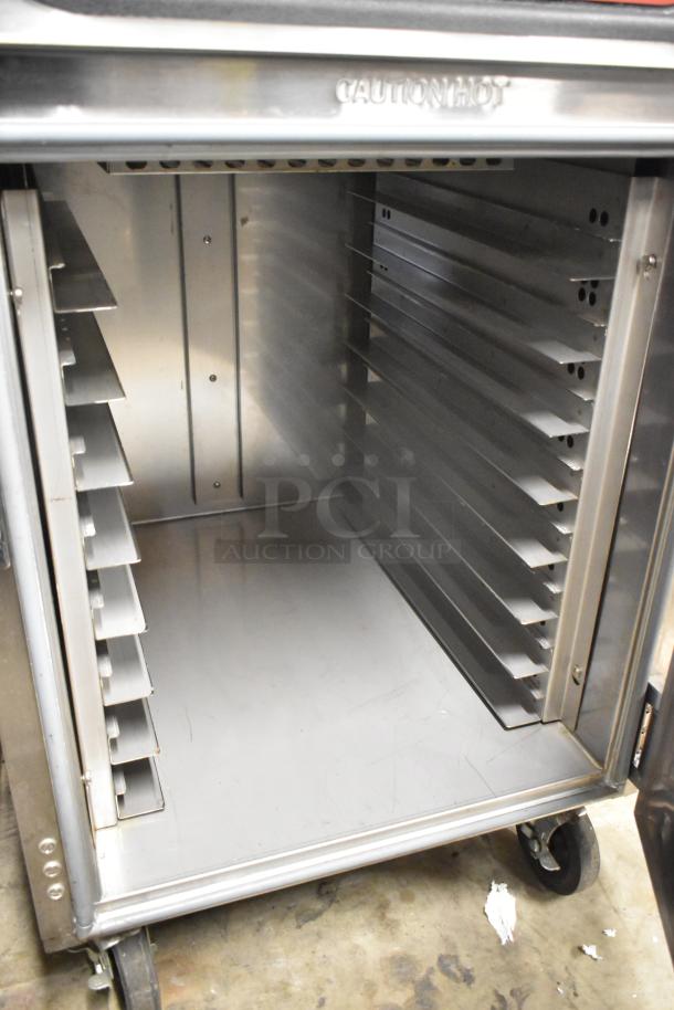 Carter Hoffmann 2018 CH1600 stainless steel cook and hold oven, commercial casters, visible warning "Caution Hot."