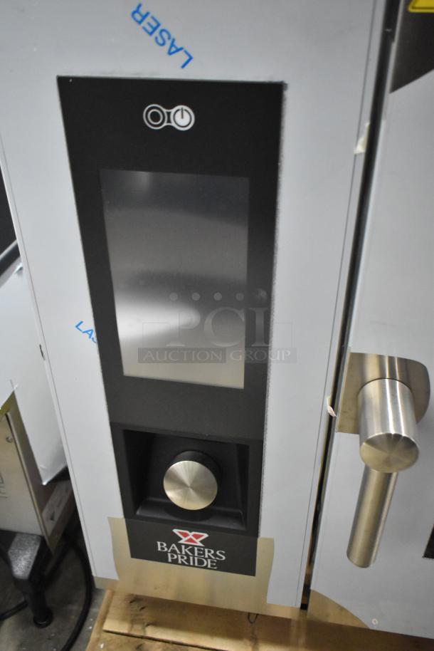 Brand new Bakers Pride AEHE061R stainless steel combi convection oven, 208 volts, 3 phase, with minor scratches and dents.
