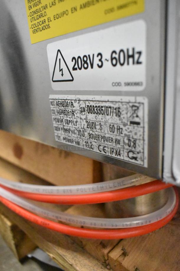 Bakers Pride AEHE061R stainless steel combi convection oven, 208V, 3-phase. New, scratch and dent. Power labels visible.