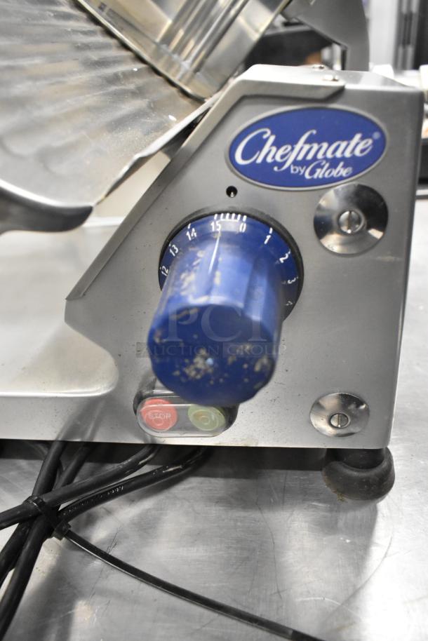 Globe Chefmate GC 512 stainless steel meat slicer with blade sharpener, 115V, 1 phase. Features adjustable slicing knob and start/stop buttons.