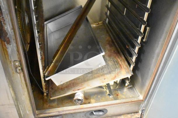 Stainless steel interior of Rational SCCWE62/SCCWE102 convection oven showing racks and tray. Electric, 480V, 3 phase.