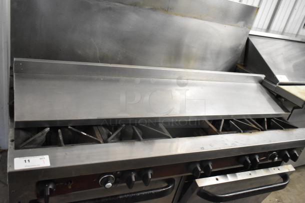 Southbend stainless steel commercial 10 burner gas range with 2 convection ovens, backsplash, overshelf, missing one spider grate.