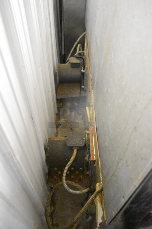 The image shows the back of a Southbend stainless steel commercial gas-powered 10-burner range. One spider grate is missing.