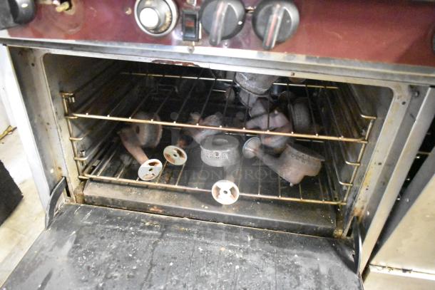 Southbend stainless steel 10-burner gas range with convection ovens, backsplash, overshelf; missing one spider grate.