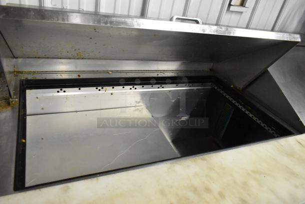 2021 True TSSU-72-30MB-ST-HC stainless steel prep table, open lid, commercial use, visible wear, suitable for salads or sandwiches.