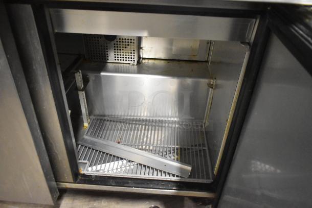 2021 True TSSU-72-30MB-ST-HC stainless steel salad prep table interior, visible wear, on commercial casters.