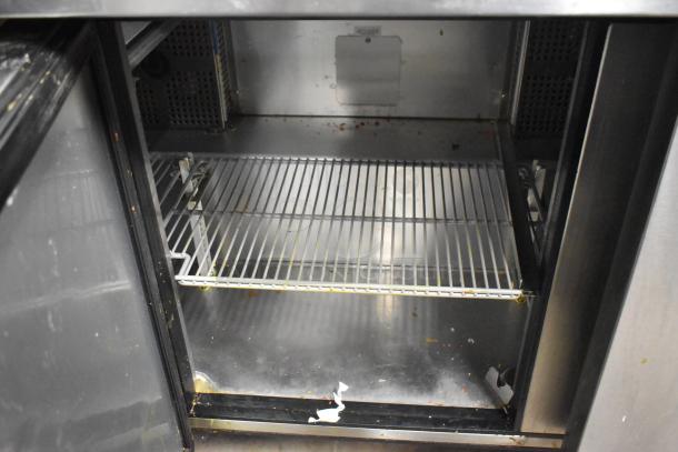 2021 True TSSU-72-30MB-ST-HC prep table interior, stainless steel, shelving visible, minor wear shown, commercial-grade.