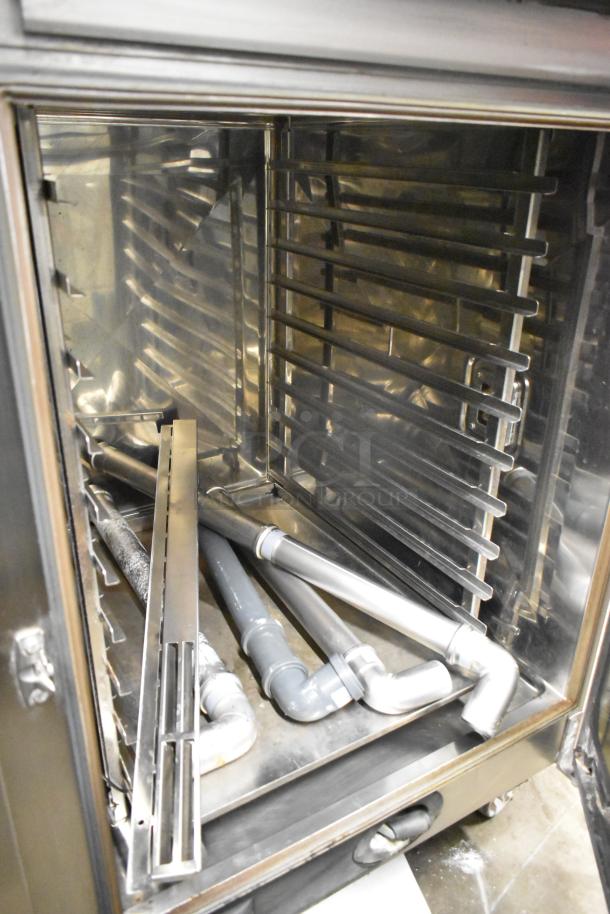 Rational SCCWE62/SCCWE102 stainless steel convection oven interior, clean and on commercial casters, 480V, 3 phase.