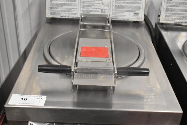 Winston CollectraMatic R620 stainless steel electric pressure fryer, 208V, 1 phase, commercial use, with visible safety label.