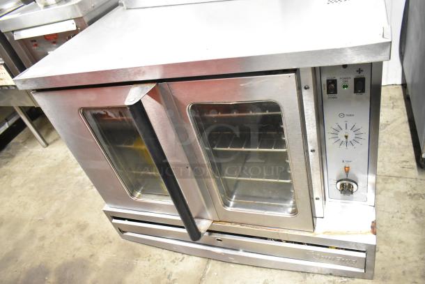 Garland SunFire stainless steel commercial convection oven with view-through doors, metal racks, and thermostatic controls.