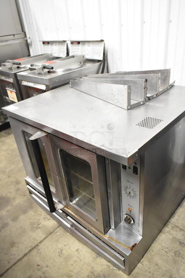 Garland SunFire stainless steel convection oven with view-through doors, metal racks, thermostatic controls, and metal legs.