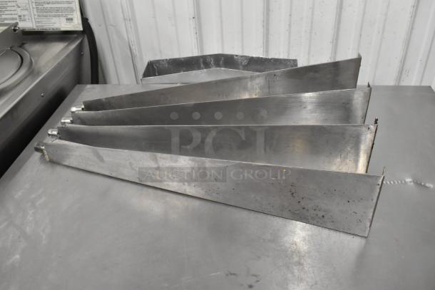 Metal oven racks from Garland SunFire stainless steel commercial convection oven, used condition, with minor scratches.