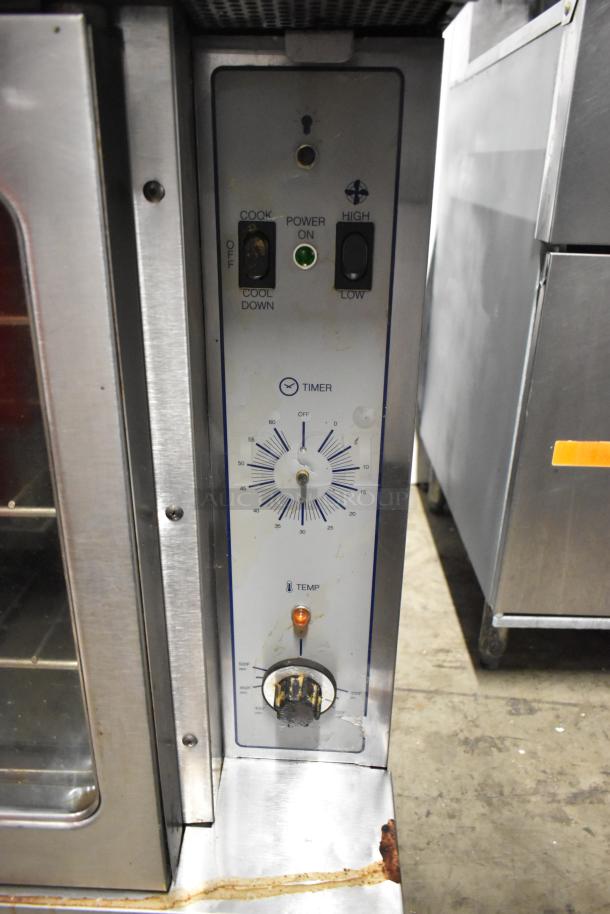 Garland SunFire stainless steel convection oven with view-through doors, thermostatic controls, and metal oven racks.