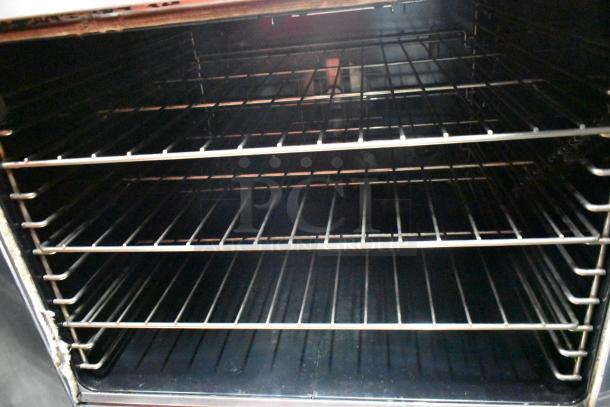 Garland SunFire stainless steel convection oven interior with metal racks. Visible oven details suggest commercial use.
