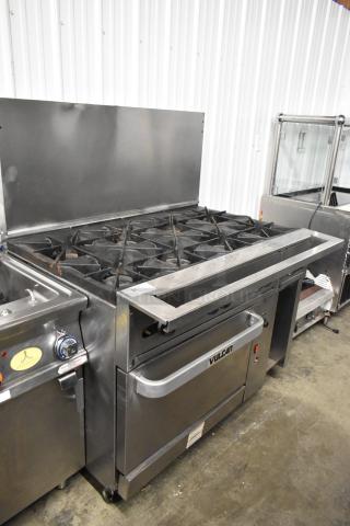 Vulcan 48C-SEFAAA stainless steel 8-burner range with convection oven, back splash, casters; natural gas-powered, commercial kitchen.