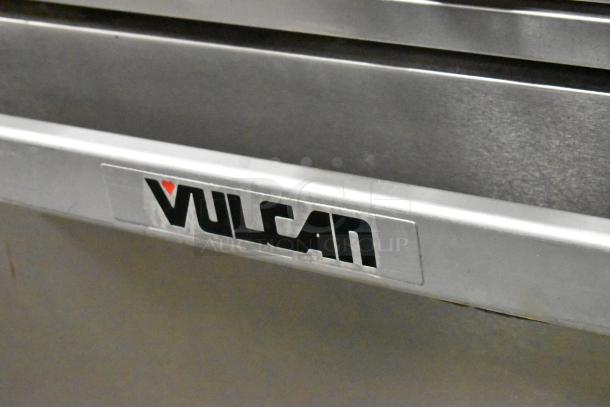 Vulcan 48C-SEFAAA stainless steel commercial range with 8 burners, convection oven, and backsplash on commercial casters.