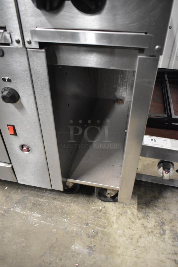 Vulcan 48C-SEFAAA stainless steel 8-burner range, convection oven, backsplash, commercial casters, natural gas-powered.